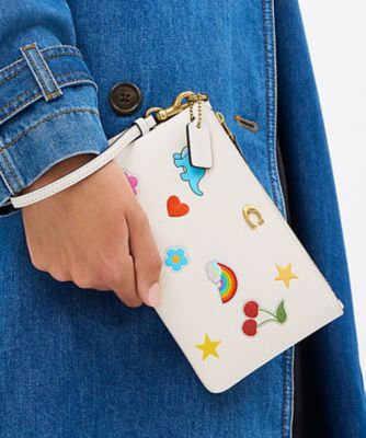 COACH/コーチ エッセンシャル スモール リストレット・ステッカー プリント WHITE 洗面化粧ポーチ【三越伊勢丹/公式】