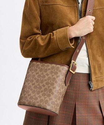 ブリーカー バケット バッグ 21・シグネチャー キャンバス | COACH 